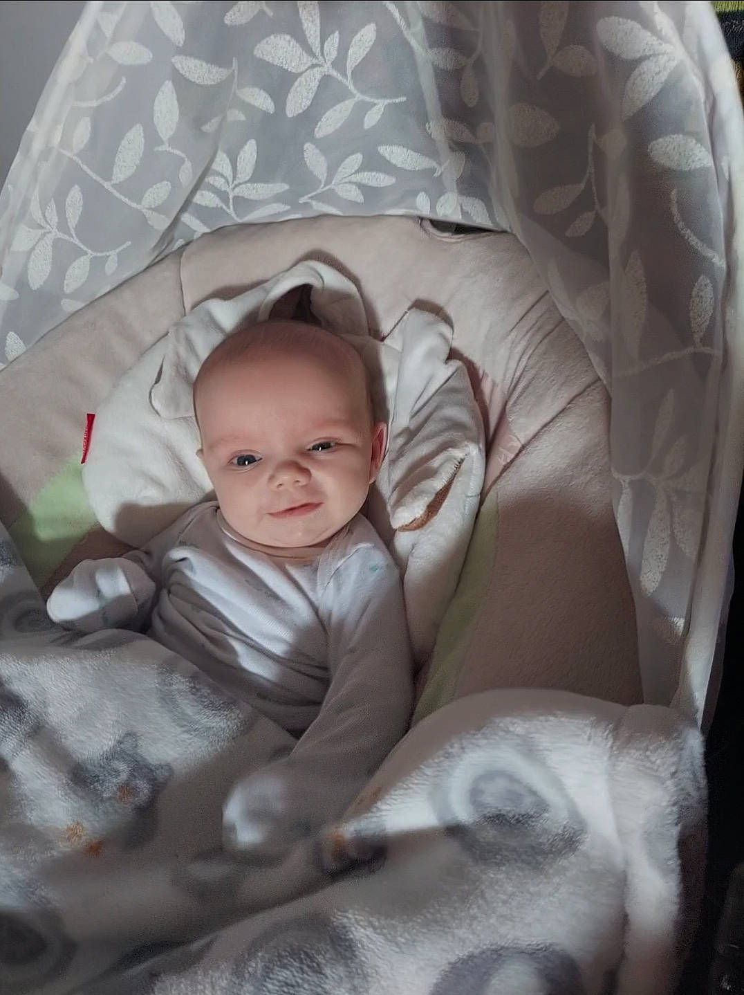 Eliza is registered to the contest to win money with this photo: baby, baby_products, baby_toddler_clothing, cheek, child, comfort, eye, face, facial_expression, flash_photography, fun, head, iris, linens, person, sitting, skin, smile, textile, toddler