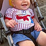 baby, smiling, stroller, outdoor, child, shorts, shirt, happy, sunlight, seatbelt, baby_clothing, footwear, white_shoes, concrete, metal_frame, playful, cute, infant, young_child, daylight