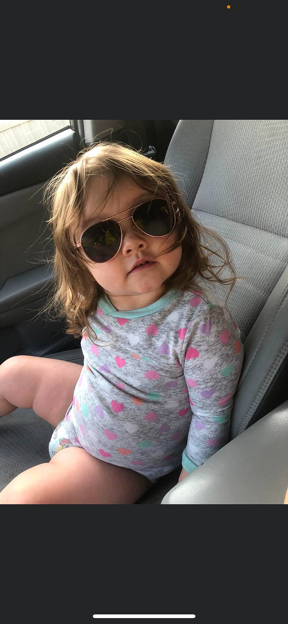 Jaiya is registered to the contest to win money with this photo: automotive_exterior, car_seat, comfort, cool, eye, eyewear, face, flash_photography, glasses, goggles, happy, lip, mouth, nose, person, skin, sunglasses, tints_and_shades, toddler, vehicle_door