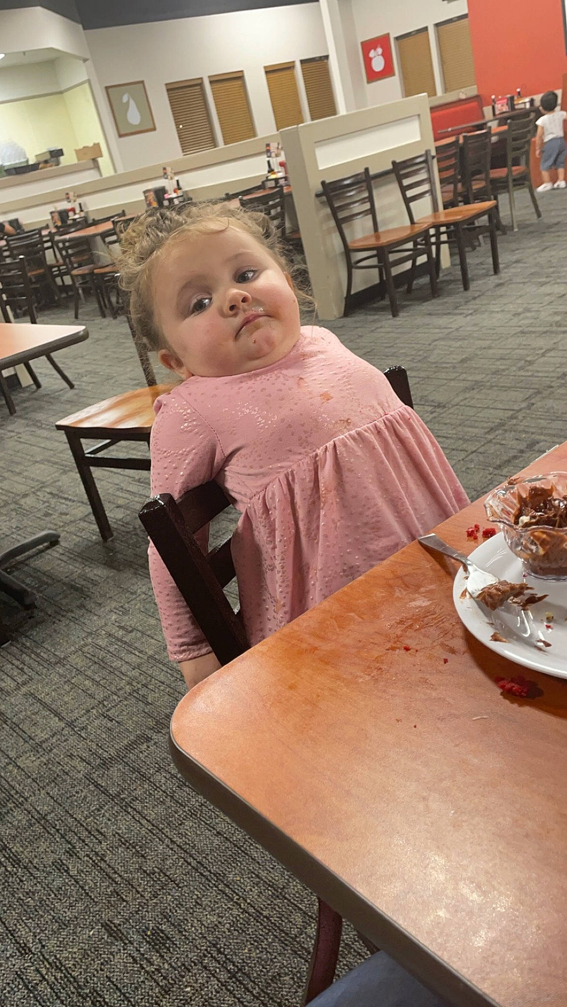 Jaiya is registered to the contest to win money with this photo: baby, baby_toddler_clothing, cake, chair, child, comfort_food, desk, dress, event, flooring, food, furniture, hardwood, person, plate, room, sitting, table, tableware, toddler