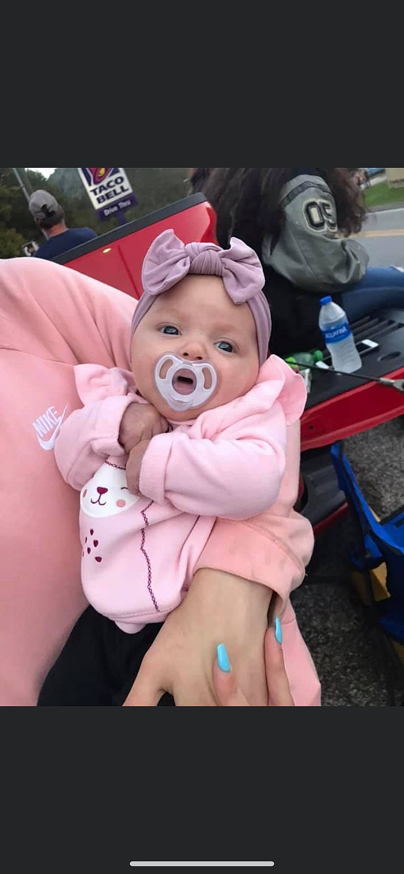 Bryleigh is registered to the contest to win money with this photo: baby, baby_products, baby_toddler_clothing, bottle, child, costume, event, fictional_character, fun, happy, hat, headwear, lap, magenta, person, pink, recreation, sitting, sun_hat, toddler