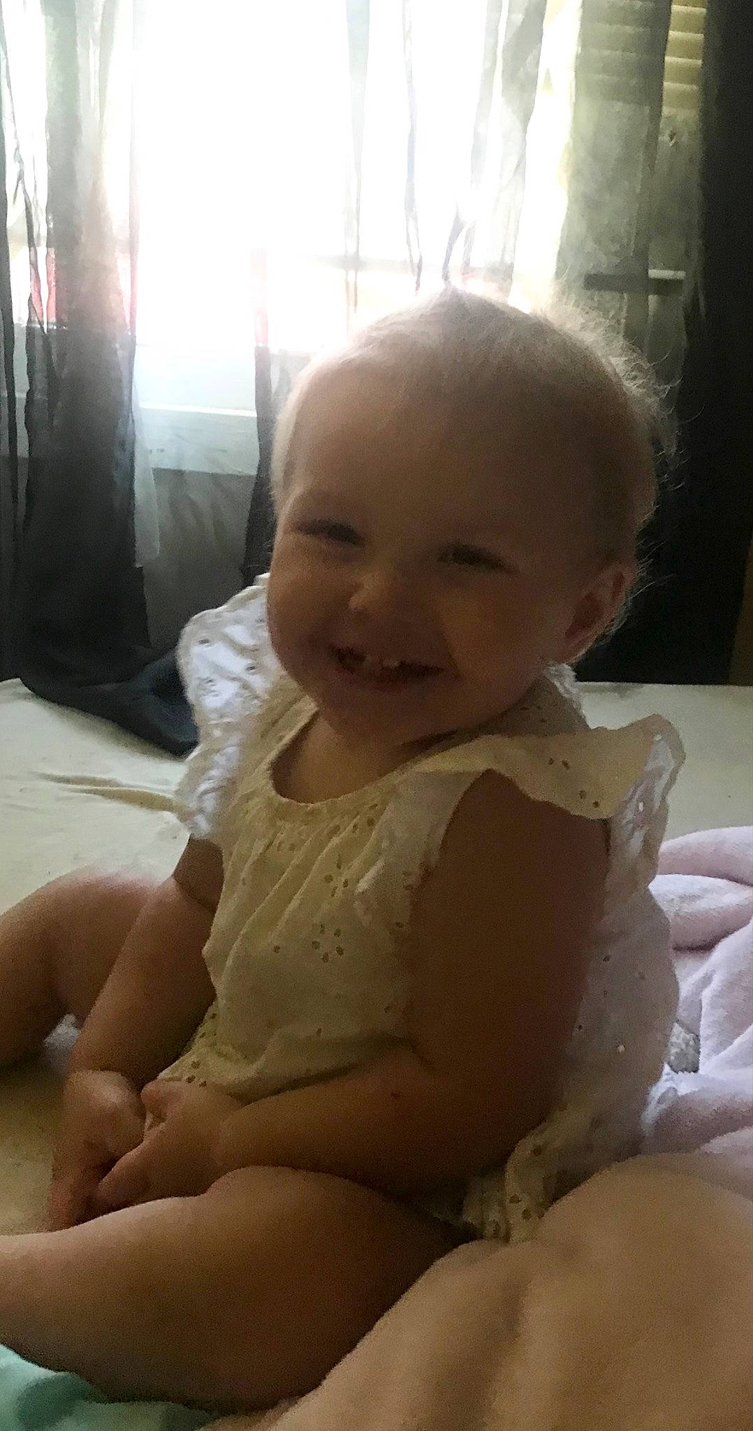 Aubree is registered to the contest to win money with this photo: baby, baby_toddler_clothing, cheek, chin, dress, eye, eyebrow, facial_expression, hairstyle, head, human_body, iris, joy, leg, lip, mouth, nose, person, shoulder, skin