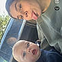 Blaze is registered to the contest to win money with this photo: child, baby, woman, car, window, seat, tongue_out, blue_eyes, casual_clothing, interior, seatbelt, natural_light, portrait, playful, young, smiling, human, person, daylight, fun