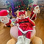 Iris Calissa Maria joined the competition — help win amazing prizes! baby, christmas, holiday, red_dress, headband, plush_toy, teddy_bear, christmas_tree, ornaments, boots, floor, wood_floor, indoor, decorations, santa_claus, festive, child, toy, person, holiday_season