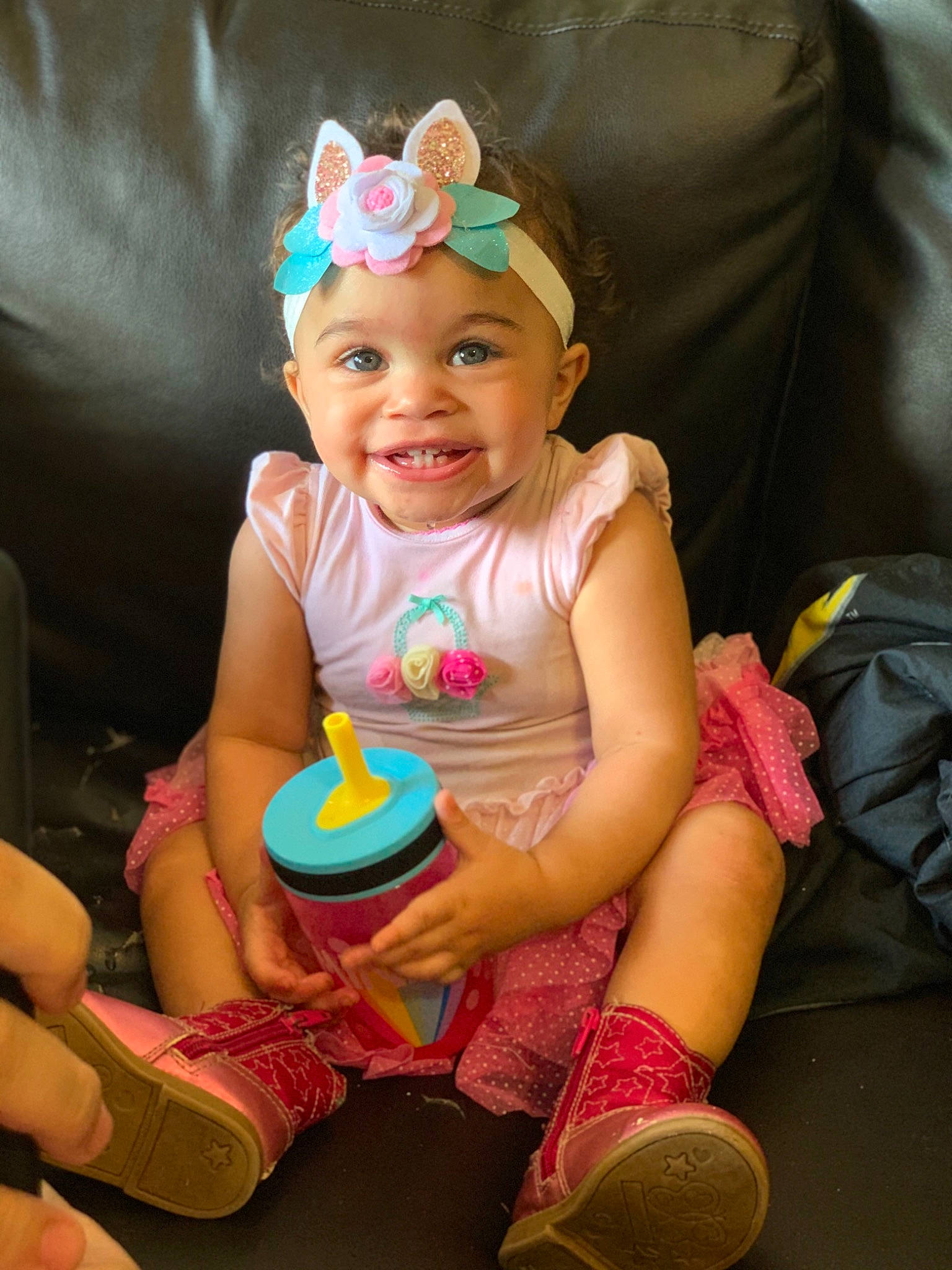 Lilyana is registered to the contest to win money with this photo: baby, baby_toddler_clothing, birthday, child, ear, hair_accessory, headband, headgear, headwear, joy, party, party_hat, party_supply, person, pink, play, sitting, skin, smile, toddler