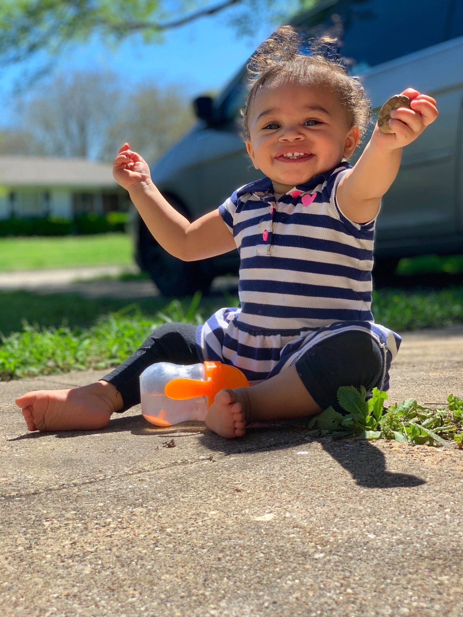 Lilyana is registered to the contest to win money with this photo: baby, barefoot, child, fun, grass, happy, joy, knee, leg, leisure, person, plant, play, playground, public_space, recreation, sitting, smile, summer, toddler