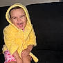 Gabby joined the competition — help win amazing prizes! toddler, child, yellow_robe, pink_socks, pajamas, laughing, smiling, sitting, couch, indoor, happy, cozy, cute, baby, face, expression, clothing, footwear, home, portrait