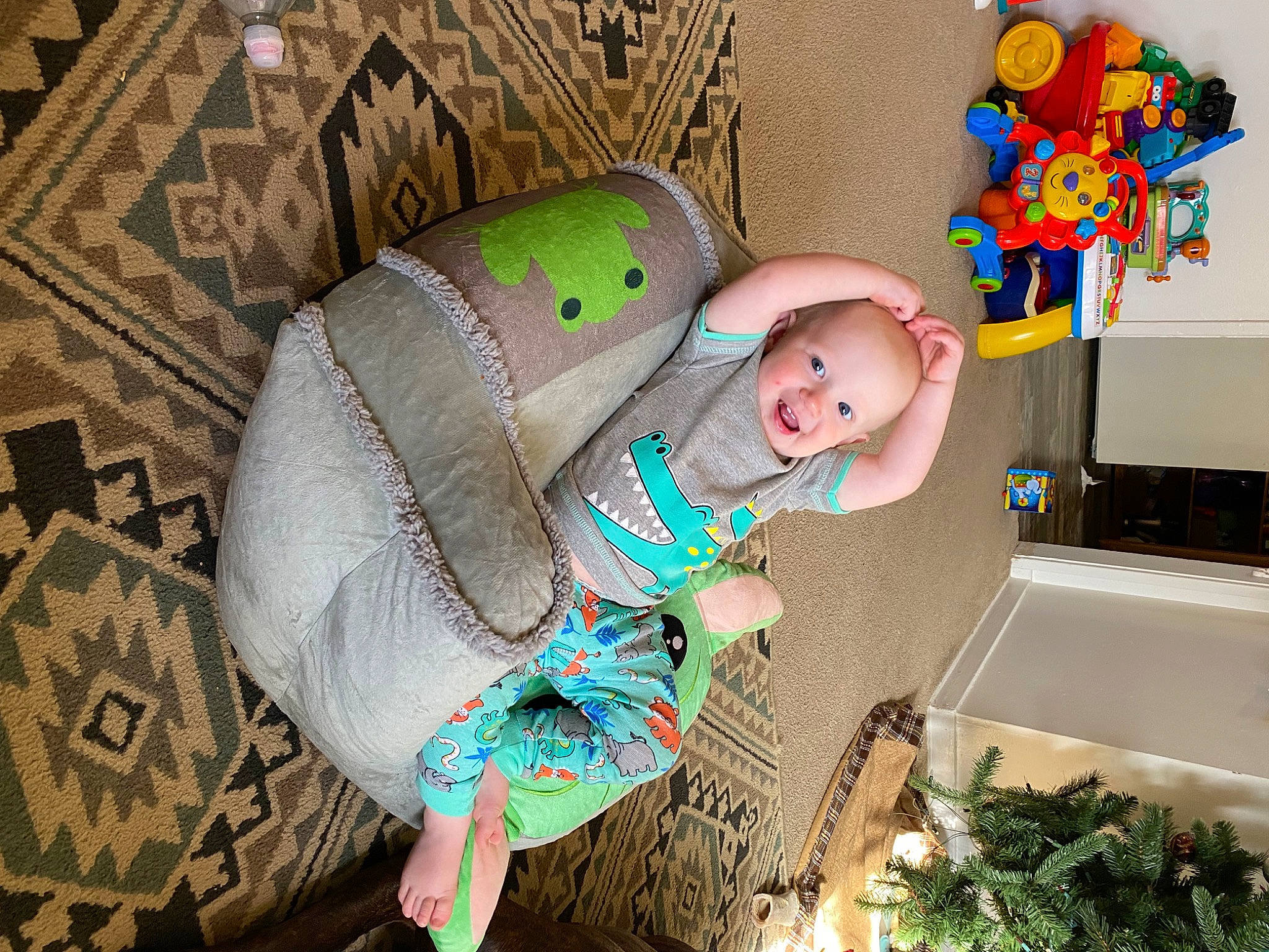 Hunter is registered to the contest to win money with this photo: baby, baby_products, baby_toddler_clothing, baby_toys, child, comfort, costume, fun, happy, linens, pattern, person, pink, plant, purple, room, sitting, smile, stuffed_toy, toddler