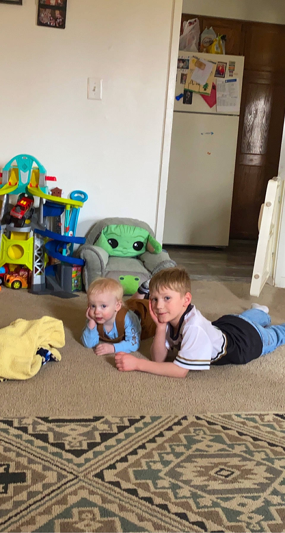 Hunter is registered to the contest to win money with this photo: baby, baby_products, child, comfort, fictional_character, floor, flooring, fun, hardwood, leisure, person, play, room, sitting, stuffed_toy, t_shirt, toddler, toy, tree, vacation