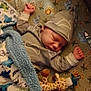 animal_print, baby, blanket, child, cozy, crib, cute, giraffe, hat, indoor, infant, mattress, newborn, pacifier, peaceful, plush_toy, resting, sleeping, sleepwear, soft