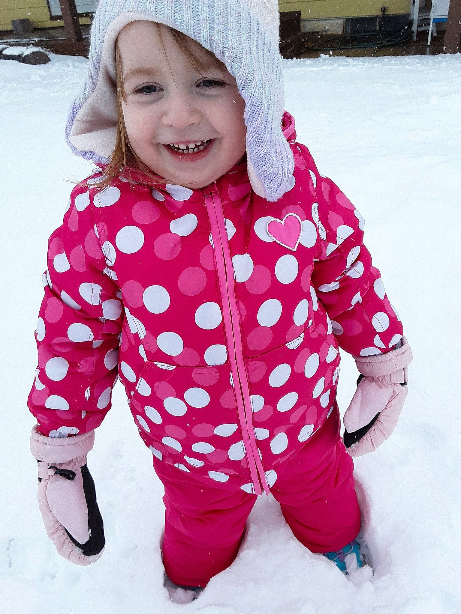 Ashtyn joined the competition — help win amazing prizes! baby_toddler_clothing, cheek, child, clothing, design, fun, headgear, hood, joy, outerwear, pattern, person, pink, play, playing_in_the_snow, polka_dot, sleeve, smile, snow, toddler