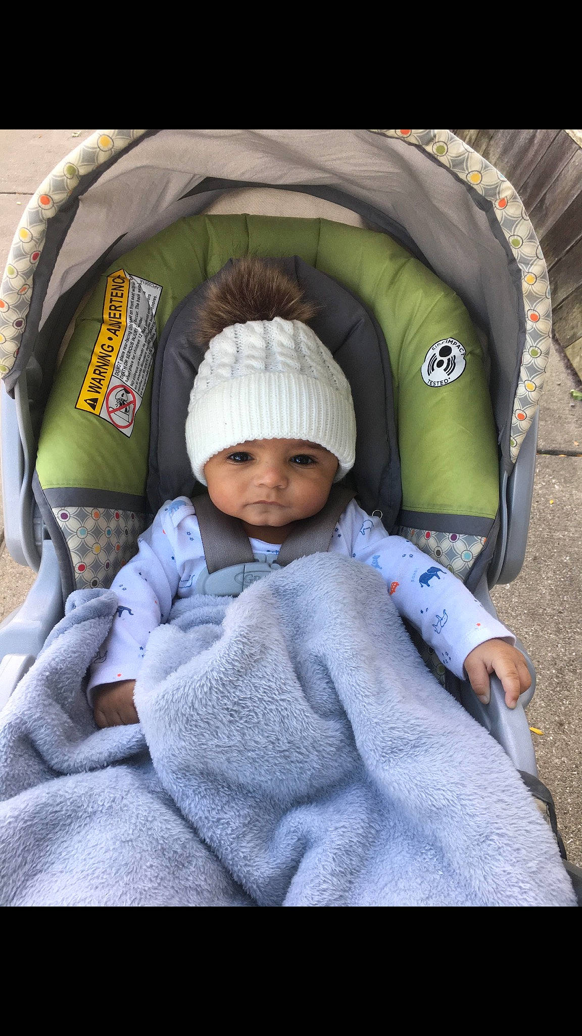 Mikah is registered to the contest to win money with this photo: baby, baby_carriage, baby_products, child, head, headgear, headwear, person, product