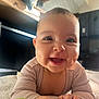 Loujayne participe au concours pour gagner de l'argent avec cette photo : baby, blanket, cheeks, child, clothing, couch, cute, expression, face, furniture, hand, happy, head, indoor, infant, person, skin, smiling, toy, young