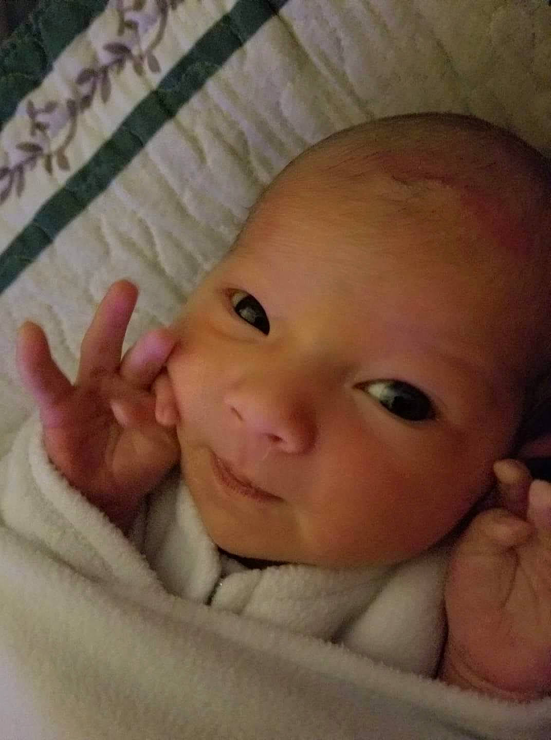 Kathleen is registered to the contest to win money with this photo: baby, cheek, child, chin, close_up, eye, eyebrow, face, finger, forehead, hand, head, iris, lip, mouth, muscle, nose, organ, person, skin