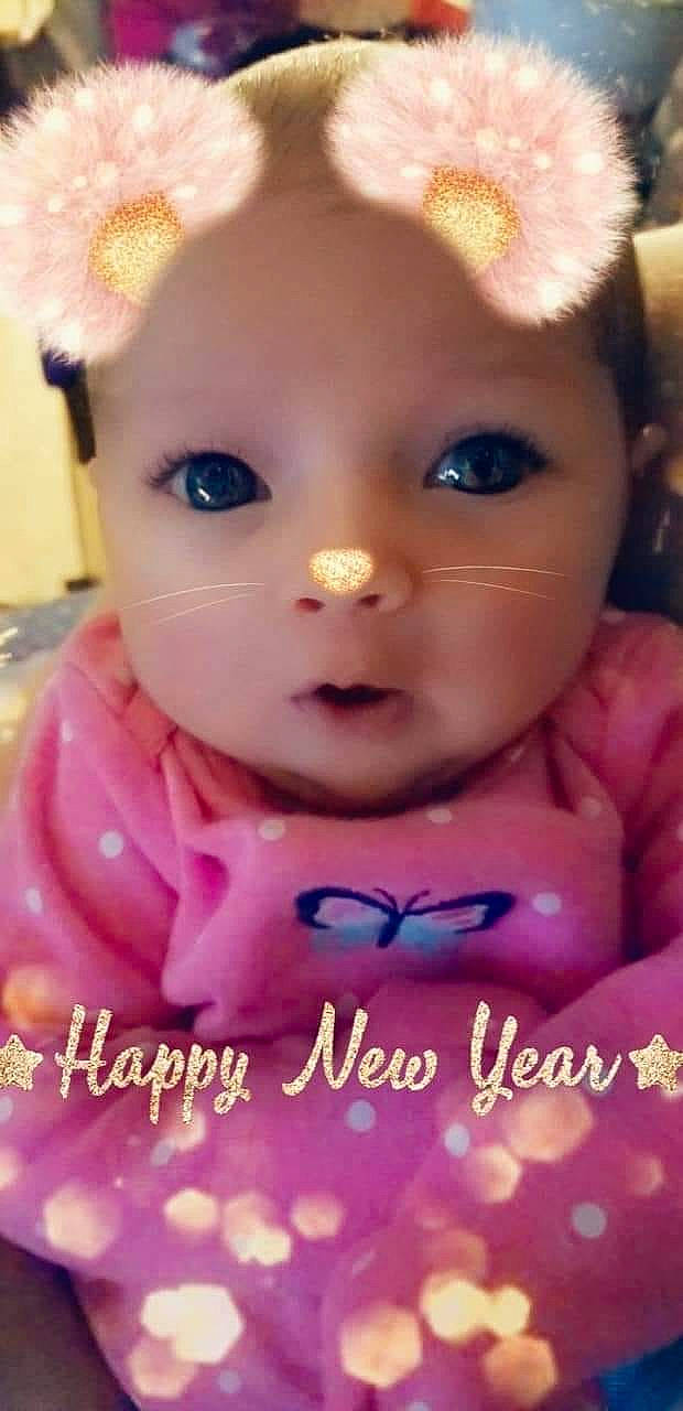 Kathleen is registered to the contest to win money with this photo: baby, brown_hair, cheek, child, doll, eye, eyebrow, eyelash, face, forehead, hair_accessory, head, iris, lip, person, photo_caption, pink, skin, smile, toddler
