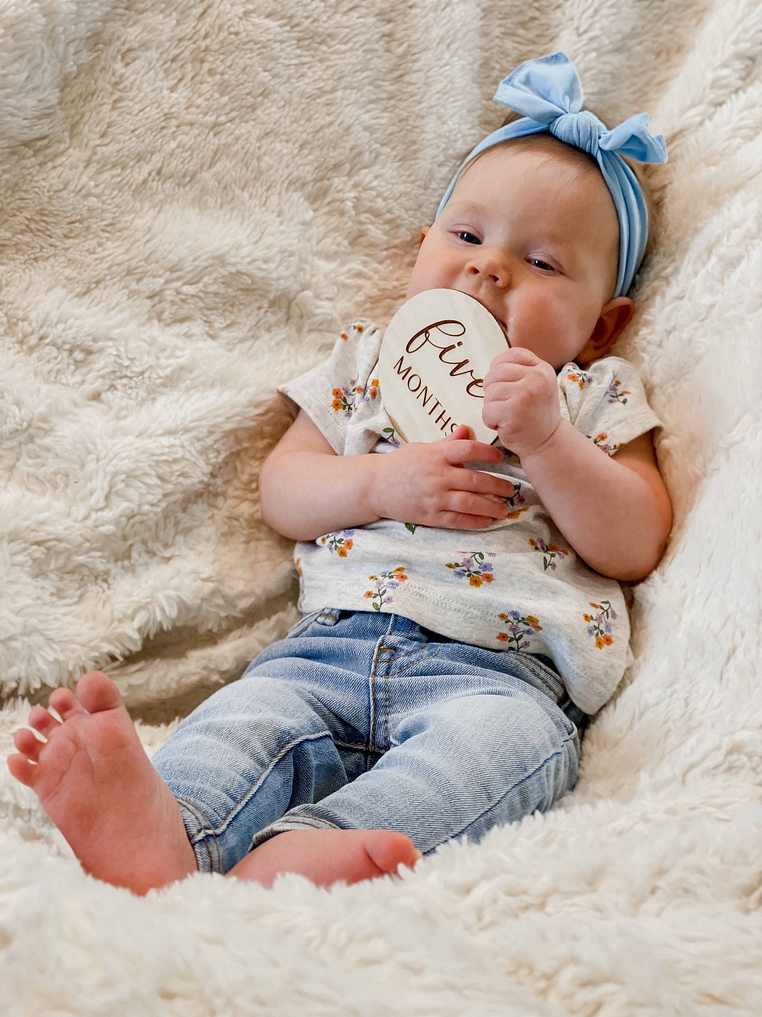 Heidi is registered to the contest to win money with this photo: arm, baby, baby_sleeping, baby_toddler_clothing, barefoot, child, comfort, eye, finger, flash_photography, hand, happy, hat, human_body, jeans, leg, person, skin, textile, thigh