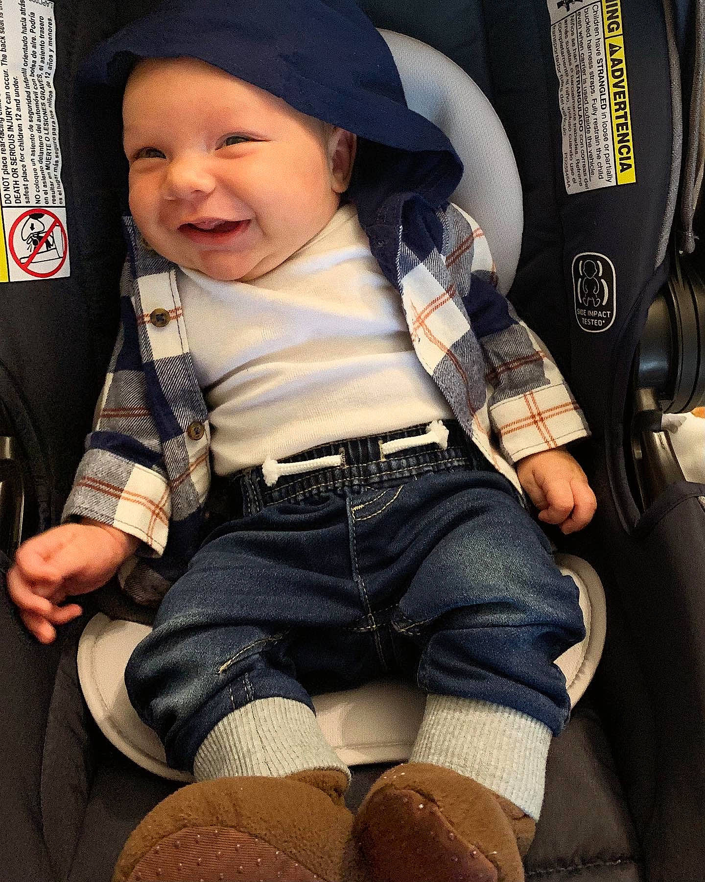 Evander joined the competition — help win amazing prizes! auto_part, baby, baby_carriage, baby_in_car_seat, baby_toddler_clothing, cap, car_seat, comfort, cool, headwear, human_leg, knee, pattern, person, plaid, sitting, sleeve, smile, sock, thigh