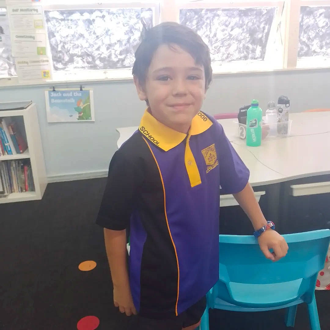 Leighton joined the competition — help win amazing prizes! arm, bookcase, child, electric_blue, fun, happy, joint, joy, leisure, person, picture_frame, room, shelf, sleeve, smile, sportswear, standing, t_shirt, table, tableware