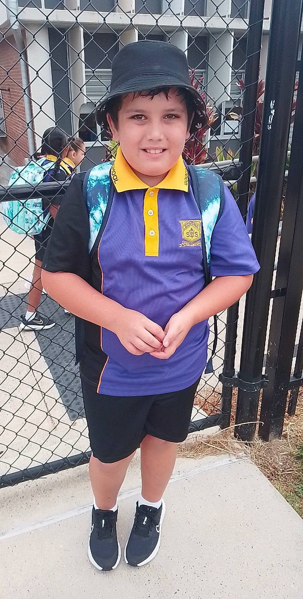 Kayden joined the competition — help win amazing prizes! blue, cap, clothing, costume, electric_blue, fashion_accessory, fence, happy, hat, headwear, human_leg, joy, knee, person, personal_protective_equipment, recreation, shorts, sleeve, sock, sports_uniform