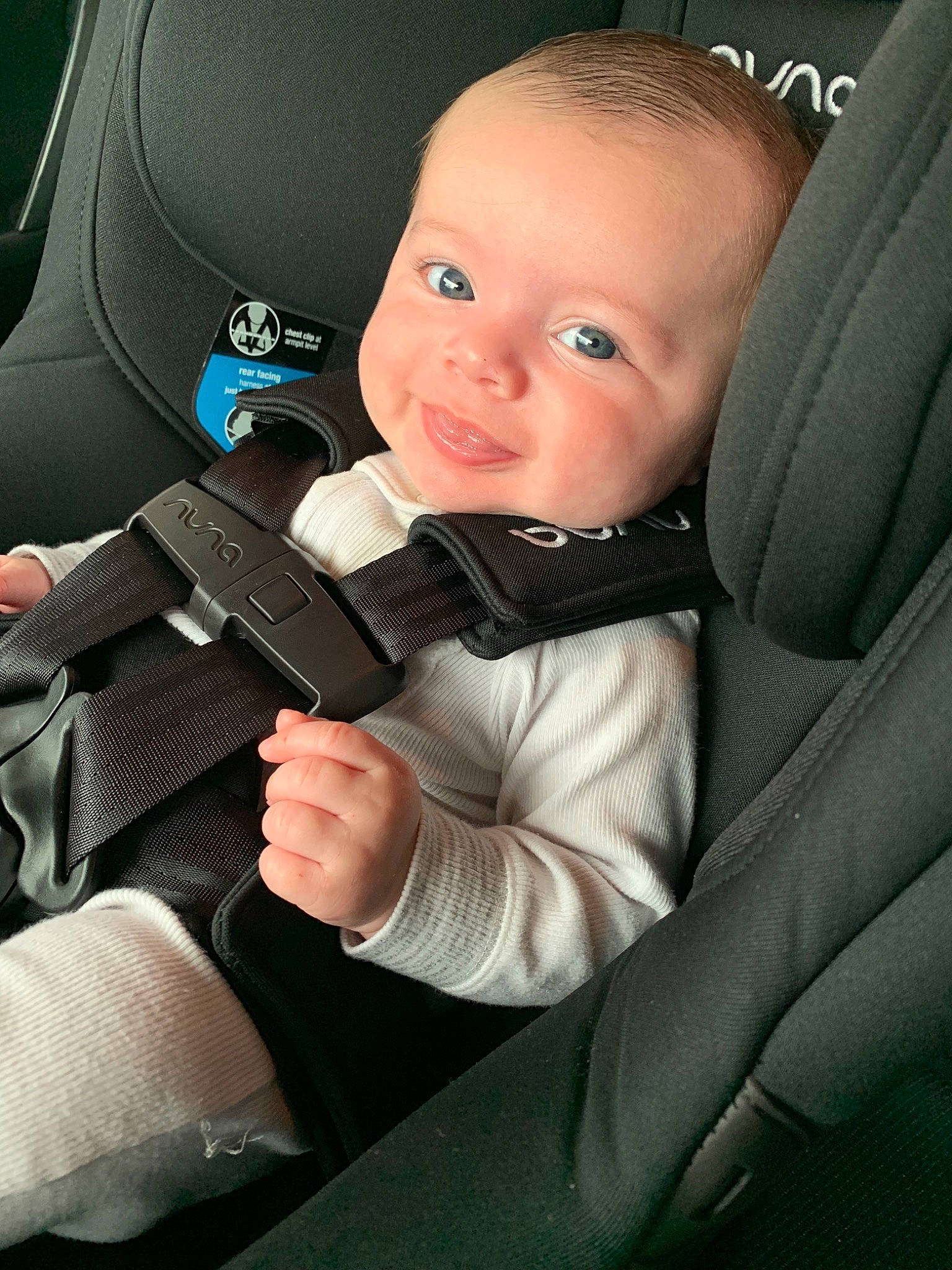 Fynn is registered to the contest to win money with this photo: auto_part, automotive_window_part, baby, baby_in_car_seat, car, car_seat, child, driving, head_restraint, person, seat_belt, steering_wheel, toddler, vehicle_door