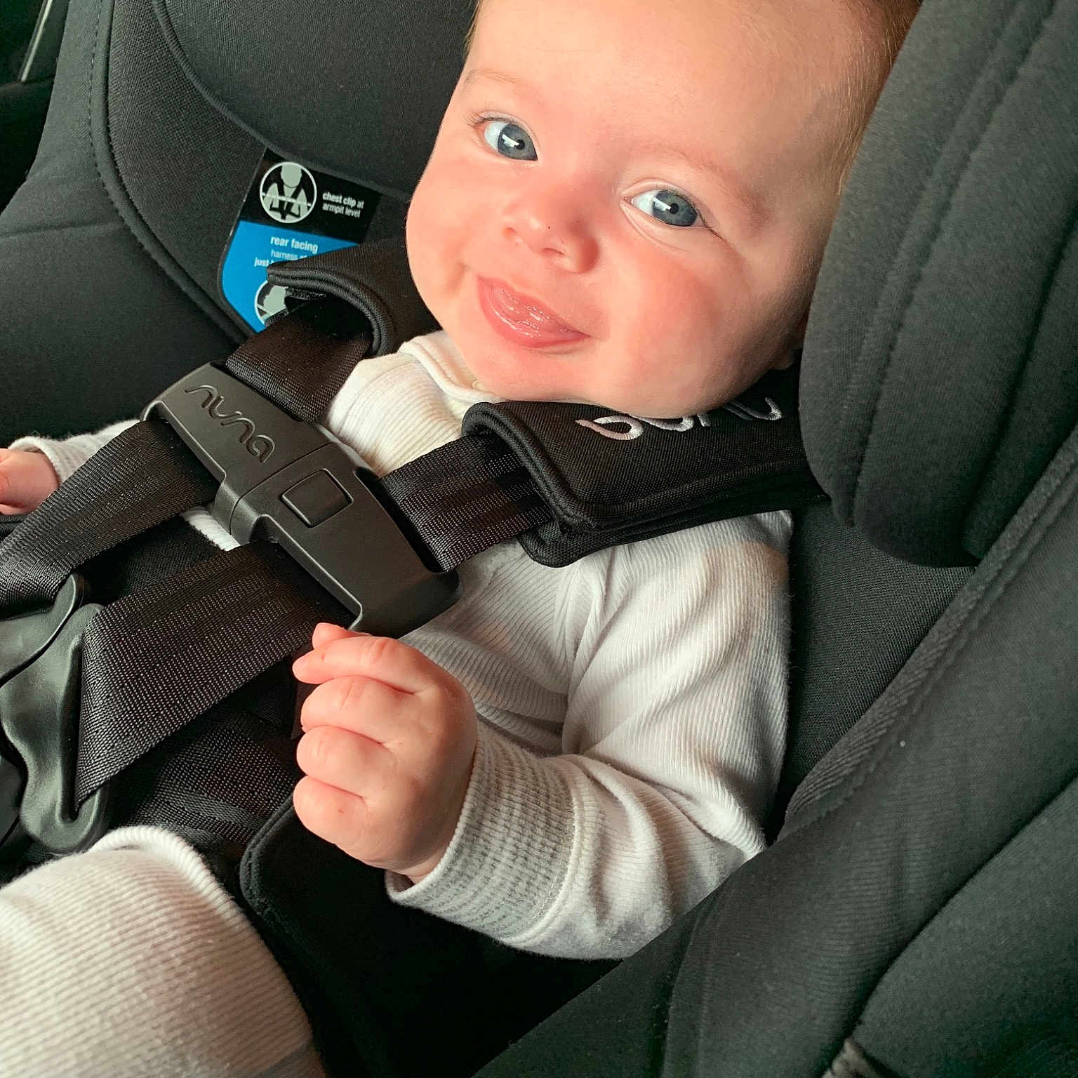 Fynn is registered to the contest to win money with this photo: auto_part, automotive_window_part, baby, baby_in_car_seat, car, car_seat, child, driving, head_restraint, person, seat_belt, steering_wheel, toddler, vehicle_door