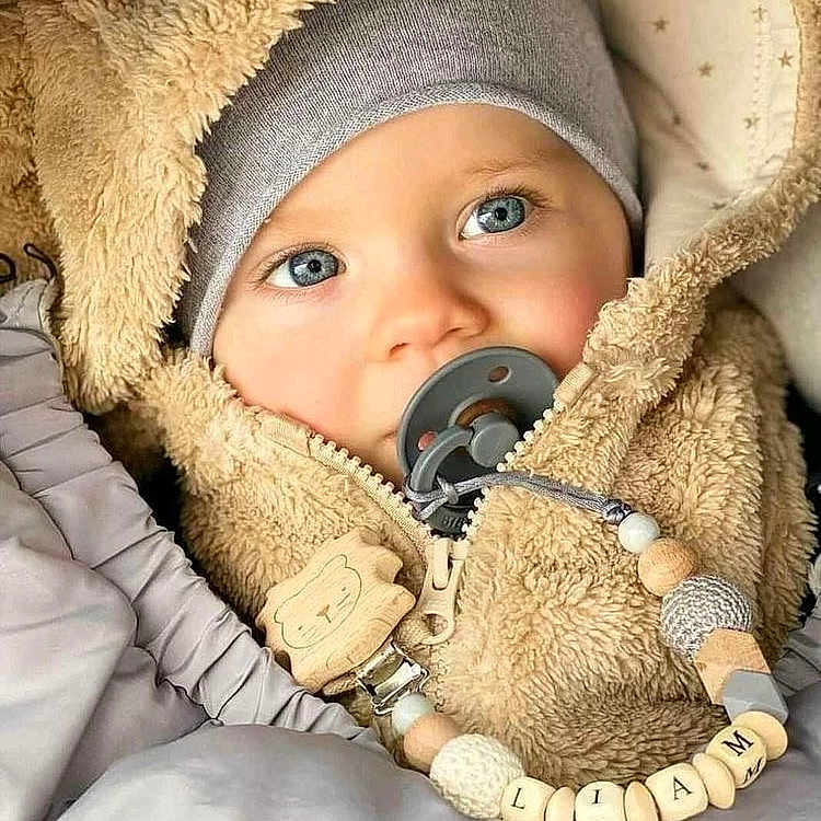 Liam joined the competition — help win amazing prizes! baby, biting, blanket, bonnet, clothing, face, happy, hat, head, person