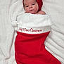Emiliano joined the competition — help win amazing prizes! baby, blanket, celebration, child, christmas, christmas_stocking, cozy, cute, cute_face, festive, holiday, infant, lying_down, newborn, portrait, red_hat, sleepy, small, soft_texture, wrapped