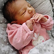 Kelly participe au concours pour gagner de l'argent avec cette photo : newborn, baby, infant, sleeping, blanket, pink_clothing, soft_texture, cozy, cute, face, hand, resting, indoor, portrait, child, newborn_clothing, pattern, plush, cute_baby, peaceful