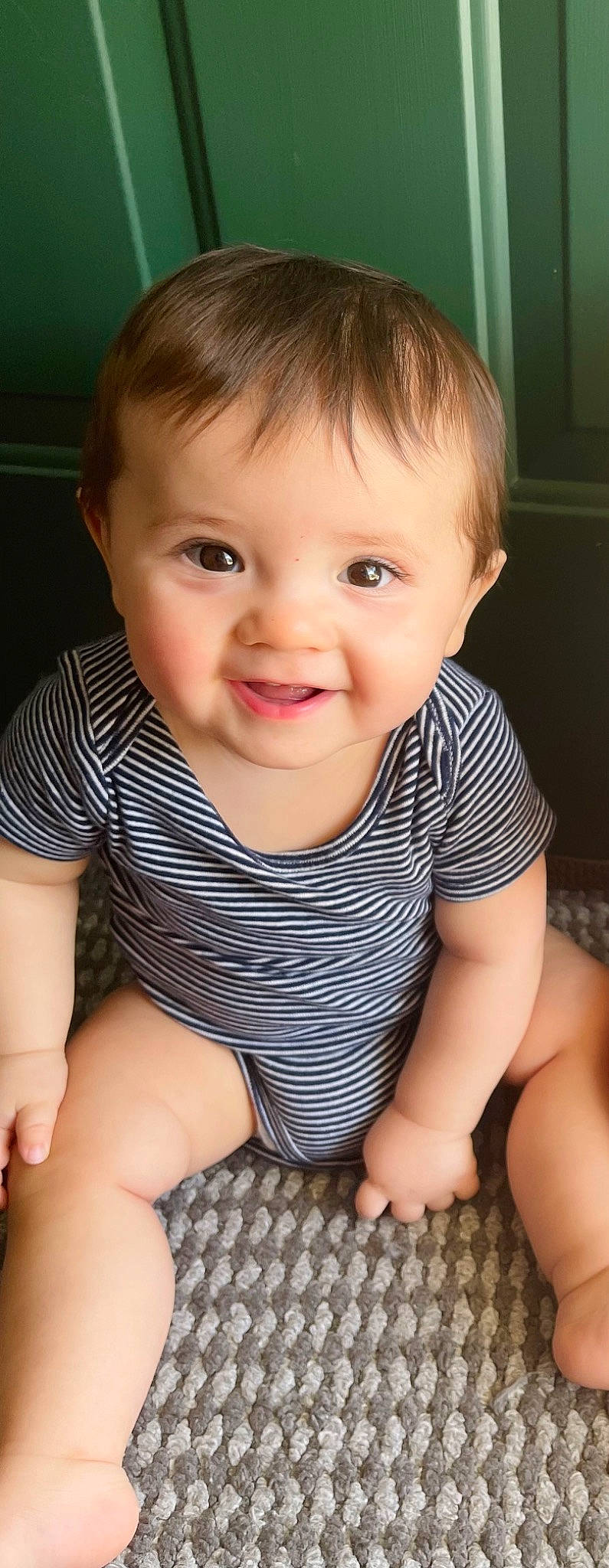 Levi is registered to the contest to win money with this photo: arm, baby_toddler_clothing, cheek, chin, eye, eyebrow, face, hand, head, human_body, joint, joy, leg, lip, mouth, nose, organ, person, product, skin