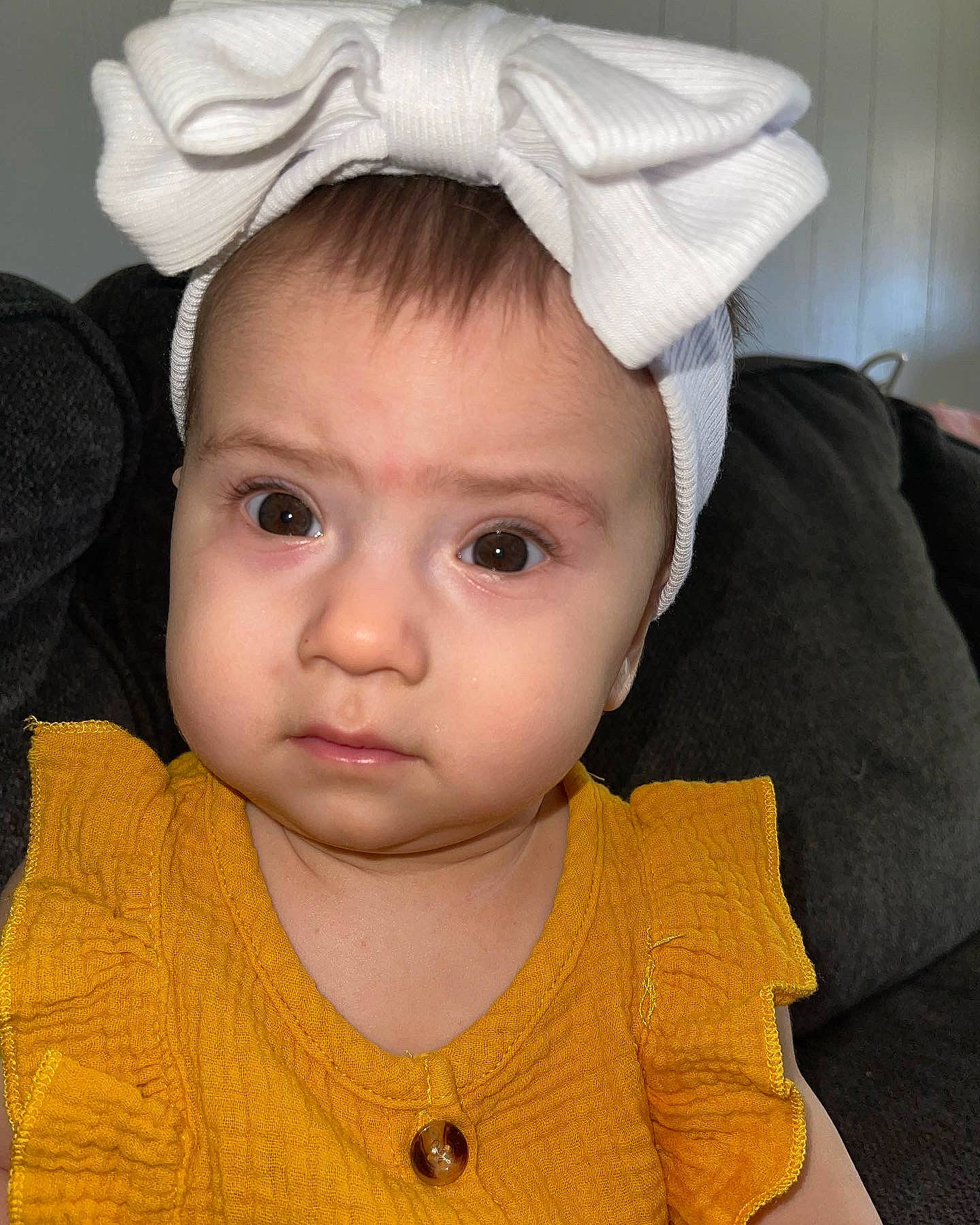 Sunni is registered to the contest to win money with this photo: baby, baby_toddler_clothing, cap, cheek, chin, ear, eye, eyebrow, eyelash, face, forehead, hairstyle, head, human_body, lip, neck, nose, outerwear, person, skin