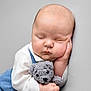Micahel Jr joined the competition — help win amazing prizes! baby, sleeping, teddy_bear, soft_toy, child, cute, peaceful, nap, infant, hand, face, clothing, blue, white, plush, portrait, closeup, resting, adorable, background