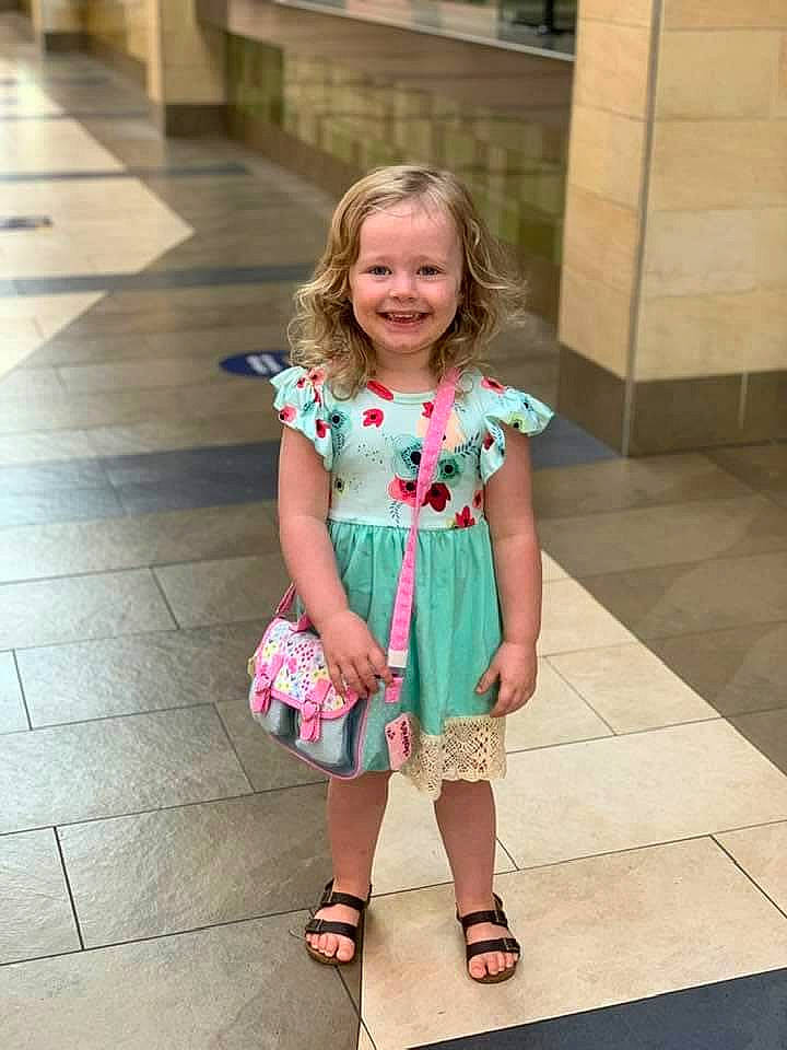 Macie is registered to the contest to win money with this photo: child, child_model, dress, fashion_accessory, footwear, joy, pattern, person, pink, plant, shoe, summer, toddler, vacation