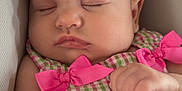 Aspen joined the competition — help win amazing prizes! baby, infant, sleeping, headband, pink_bow, pink, dress, gingham, checkered, hand, face, cheeks, lips, eyelashes, car_seat, seat, portrait, closeup, cute, newborn