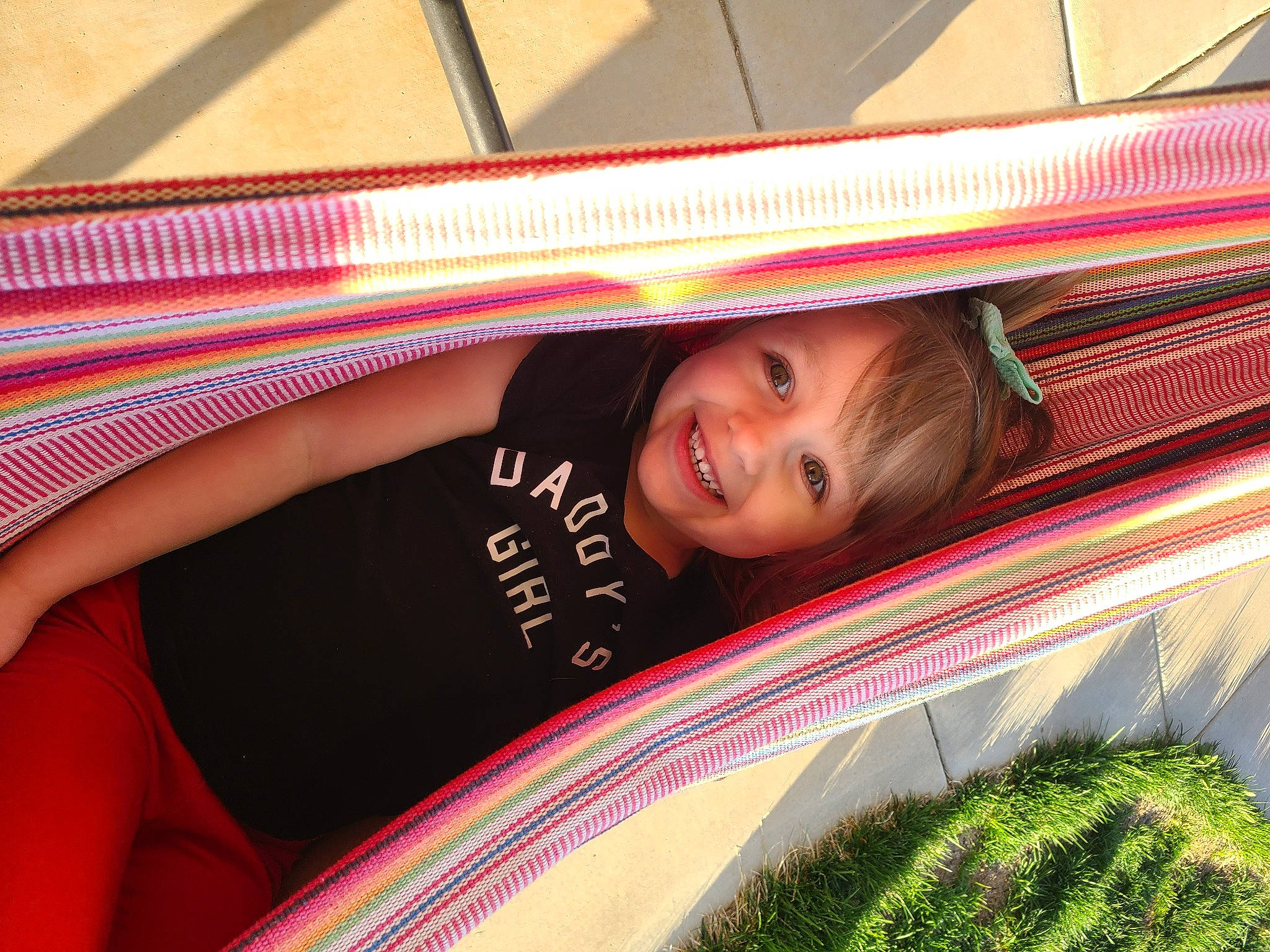 Charlee is registered to the contest to win money with this photo: beauty, eye, fun, grass, hammock, happy, head, joy, leisure, light, line, magenta, pattern, person, plant, shade, skin, smile, textile, tints_and_shades