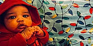 Kycen joined the competition — help win amazing prizes! baby, background, child, christmas_lights_pattern, colorful, cozy, curious, cute, expression, face, festive, hands, hoodie, indoor, infant, person, portrait, red_clothing, warm_clothing, young_child