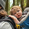 Royal joined the competition — help win amazing prizes! toddler, child, adult, beanie, backpack, forest, outdoor, nature, curly_hair, blue_carrier, resting, portrait, closeup, person, head, hand, clothing, casual, daylight, expression
