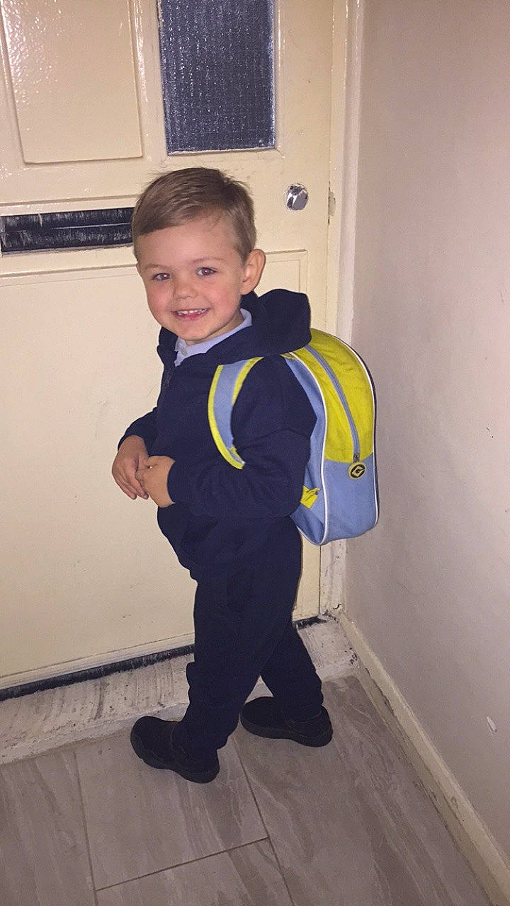 Georgie is registered to the contest to win money with this photo: active_pants, arm, baby_toddler_clothing, child, electric_blue, floor, flooring, formal_wear, fun, happy, hardwood, home_appliance, joy, person, personal_protective_equipment, room, shoulder, sleeve, smile, sweatpant