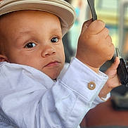 Kameron a rejoint le concours — aidez-le/la à gagner de superbes lots ! baby, blur_background, cap, car_interior, child, closeup, curious, cute, denim, expression, eyes, face, hand, hat, keys, portrait, seatbelt, sitting, toddler, white_shirt