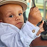 baby, blur_background, cap, car_interior, child, closeup, curious, cute, denim, expression, eyes, face, hand, hat, keys, portrait, seatbelt, sitting, toddler, white_shirt