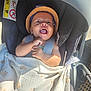 Kameron participe au concours pour gagner de l'argent avec cette photo : baby, car_seat, blanket, hat, smile, tongue_out, child, sunlight, happy, infant, seatbelt, pattern, fabric, closeup, cute, baby_clothing, safety, child_seat, joyful, outdoor