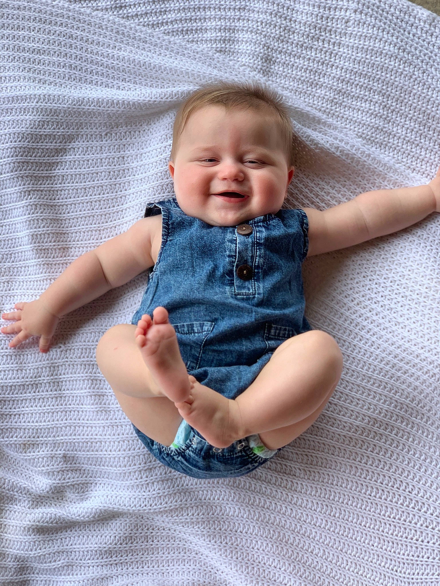 Briggs joined the competition — help win amazing prizes! baby, baby_toddler_clothing, comfort, electric_blue, eye, face, finger, grey, hand, happy, head, joy, linens, pattern, person, plaid, sitting, skin, sleeve, smile