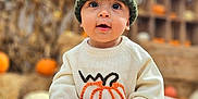 Riley is registered to the contest to win money with this photo: autumn, baby, child, cute, fall, festival, gourd, harvest, hat, hay, knit_hat, nature, orange, outdoor, portrait, pumpkin, seasonal, smiling, sweater, yellow