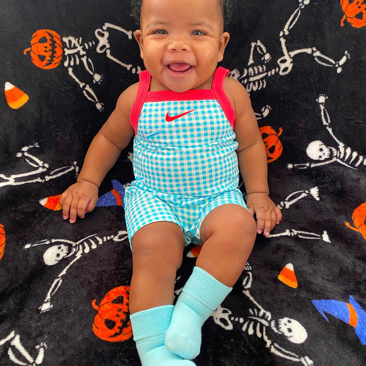 Zara joined the competition — help win amazing prizes! baby, babylaughing, clothing, dress, face, footwear, happy, head, hosiery, laughing, pants, person, photography, portrait, shoe, shorts, sitting, sleeve, smile, sock