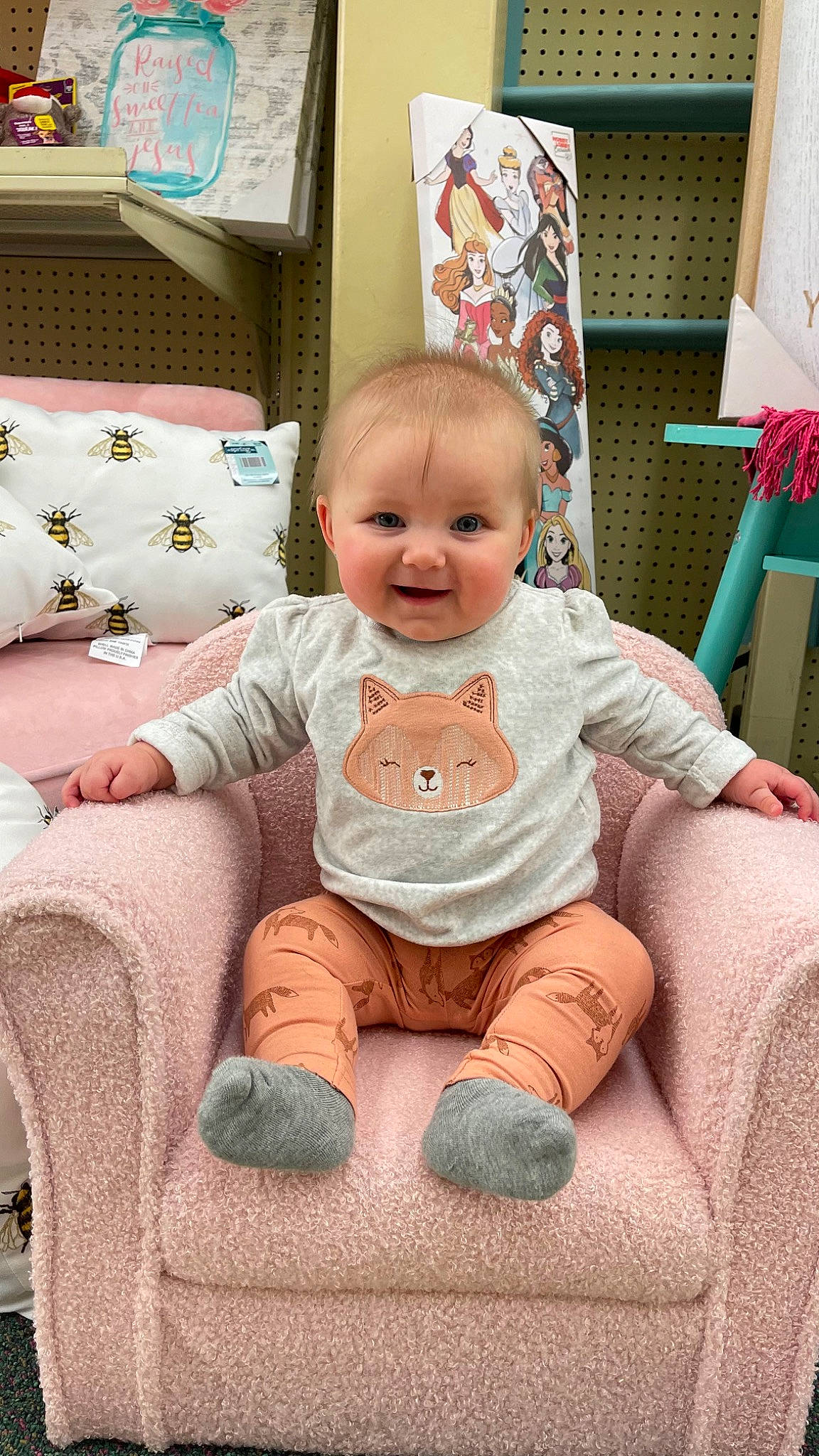 Hazel is registered to the contest to win money with this photo: baby, baby_toddler_clothing, cheek, child, comfort, eye, flooring, foot, happy, head, joy, knee, person, pink, product, sitting, sleeve, smile, textile, thigh