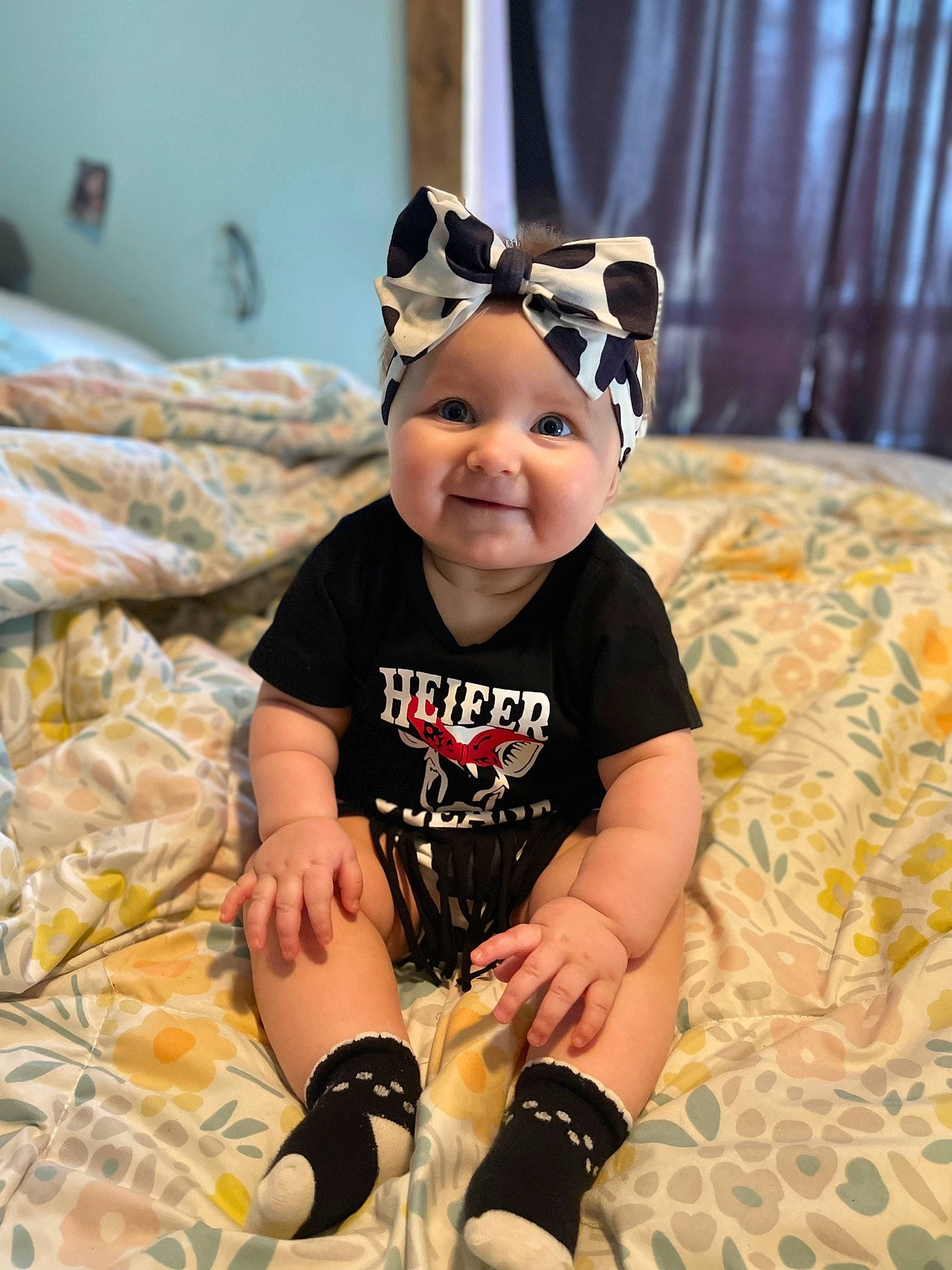 Hazel is registered to the contest to win money with this photo: baby, baby_toddler_clothing, beanie, cap, child, comfort, costume, costume_hat, face, flooring, fun, happy, head, headwear, joy, knee, pattern, person, personal_protective_equipment, sleeve