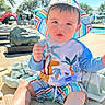 Victor joined the competition — help win amazing prizes! baby, child, hat, striped_clothing, poolside, sunny_day, outdoor, toy, cushion, lounge_chair, shorts, summer, water, trees, sky, foot, hand, person, daylight, relaxation
