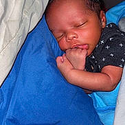 Noah joined the competition — help win amazing prizes! newborn, baby, infant, sleeping, portrait, face, closed_eyes, curled_up, hand, fist, blue_blanket, clothing, black_shirt, white_pattern, bed, bedding, indoors, peaceful, cute, nap