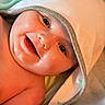 Virgil is registered to the contest to win money with this photo: baby, smiling, face, hooded_towel, pacifier, skin, child, infant, closeup, happy, cute, portrait, newborn, warm, soft, blanket, relaxation, comfort, indoors, person