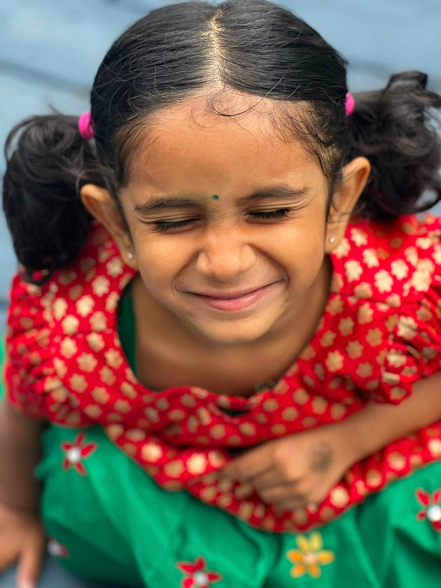 Sneha Chowdary joined the competition — help win amazing prizes! bindi, child, close-up, cute, earrings, face, fashion, flower_pattern, girl, green_skirt, happy, indoor, person, pigtails, playful, portrait, red_dress, smiling, traditional_clothing, young