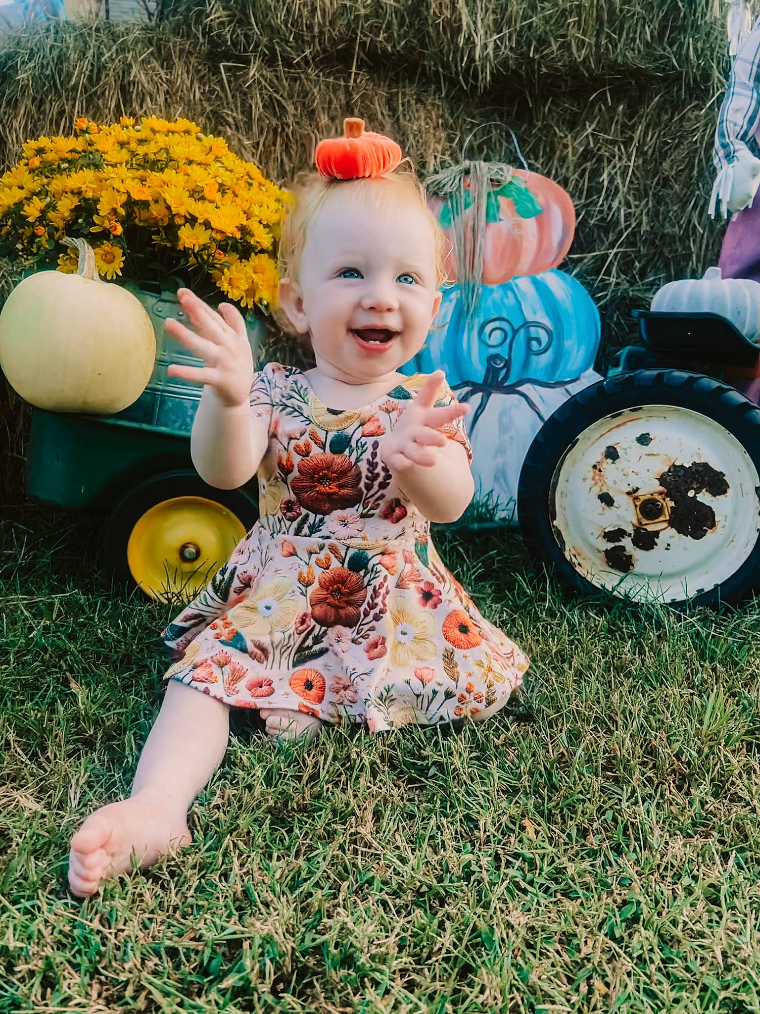 Kaydence is registered to the contest to win money with this photo: automotive_tire, automotive_wheel_system, baby_toddler_clothing, child, facial_expression, fun, grass, grass_family, happy, joy, lawn, leaf, pattern, people_in_nature, person, pink, plant, public_space, smile, tire